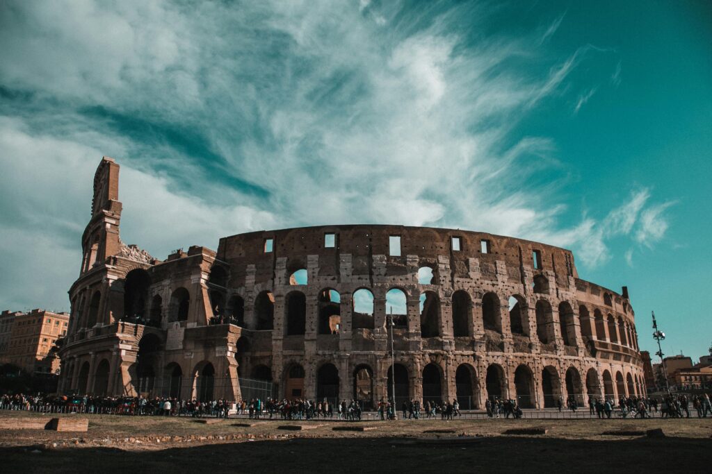 Guides Stunning view of the Colosseum in Rome showcasing its ancient architecture and historic grandeur.